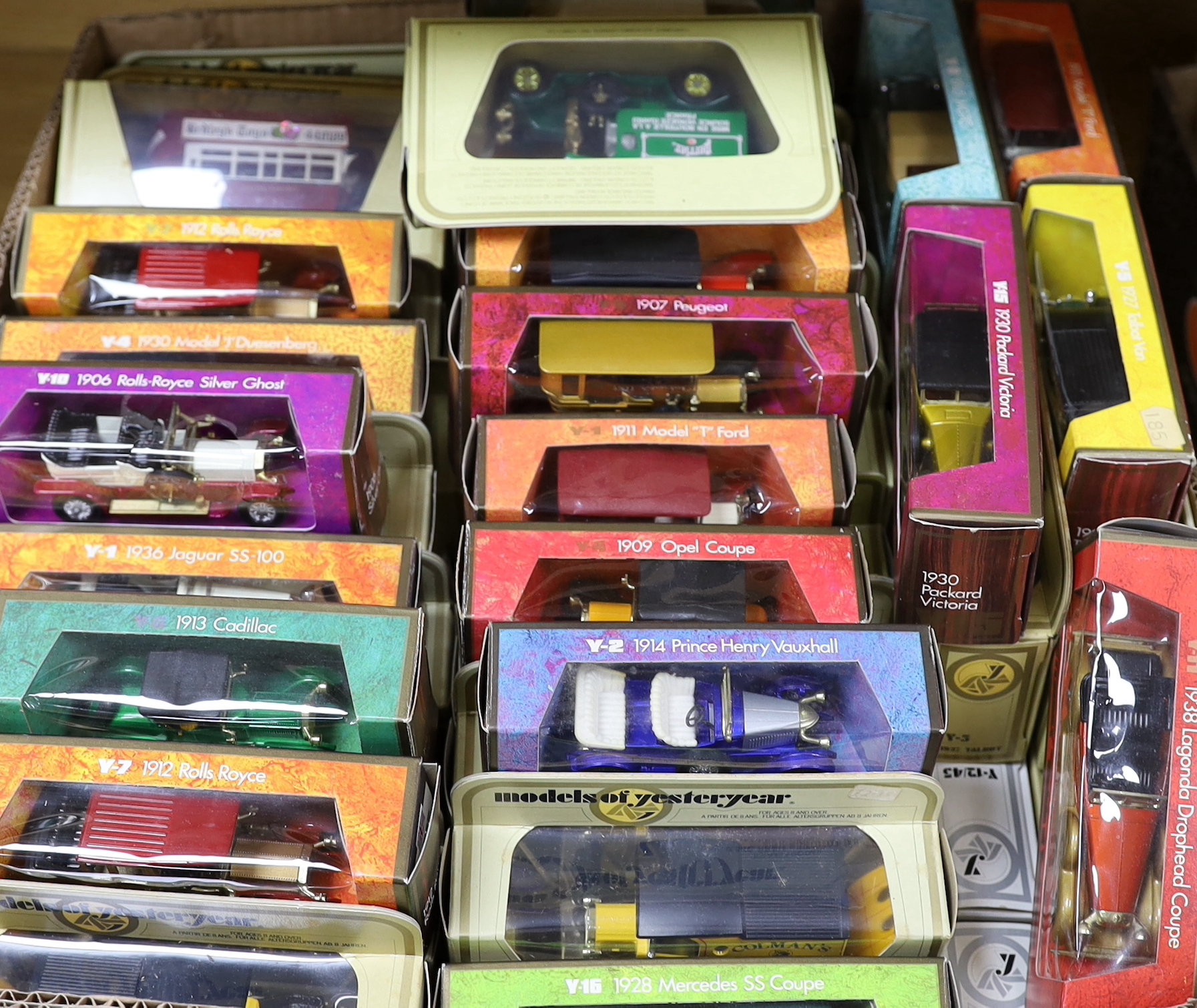 A collection of boxed Matchbox Models of Yesteryear (94 vehicles) in a variety of era boxes, mostly cream window boxes, some ‘wood effect’ boxes, etc.